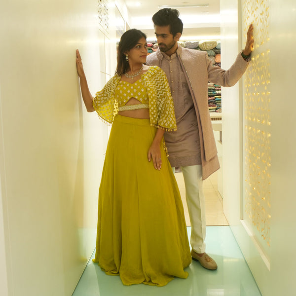Cape Style Palazzo Set in Lime Green for Women Paired with Beige Short Sherwani Set for Men