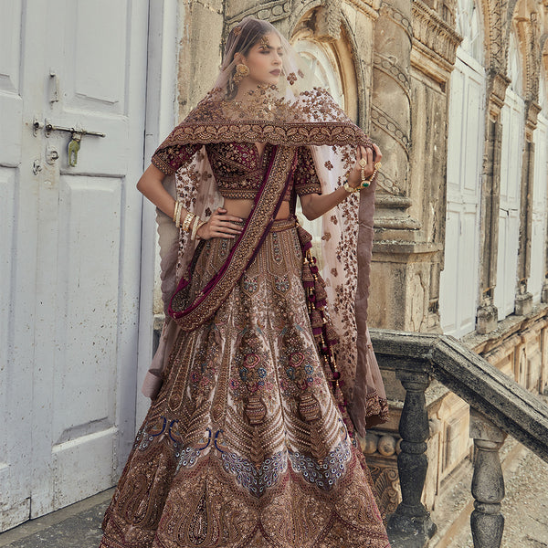 Heavy Worked Bridal Lehenga Choli Paired with Contrasted Net Dupatta