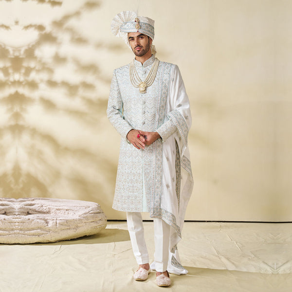Elegant White Sherwani with Royal Blue Embroidery for the Groom