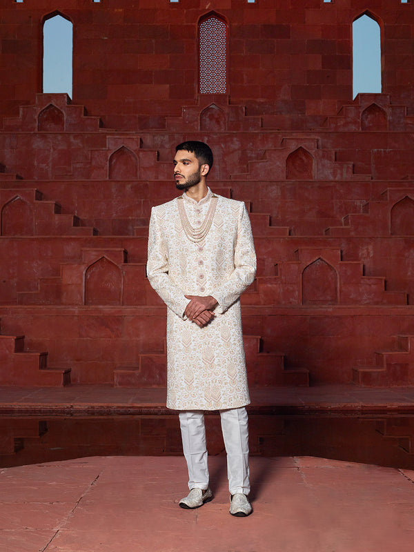 Coveted Cream Sherwani Suit Adorned With Peach Embroidery