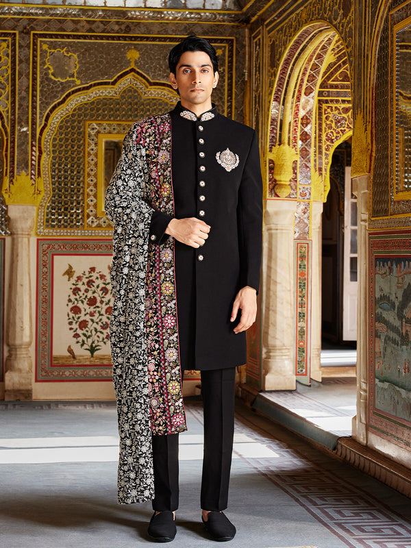 Imperial Black Sherwani Ensemble with Vintage Brooch and Multicolor Kashida Shawl