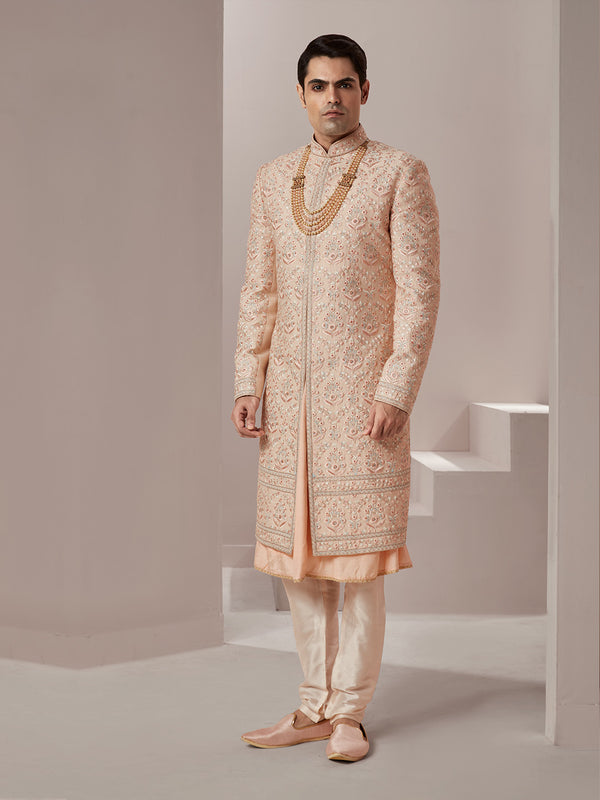 Perfectly Blended Peach Sherwani Enriched with Floral Motifs