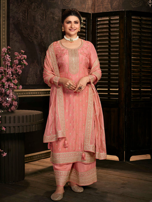 Peachish Pink Embroidered Silk Dress Adorned with Heavy Bottoms and Dupatta